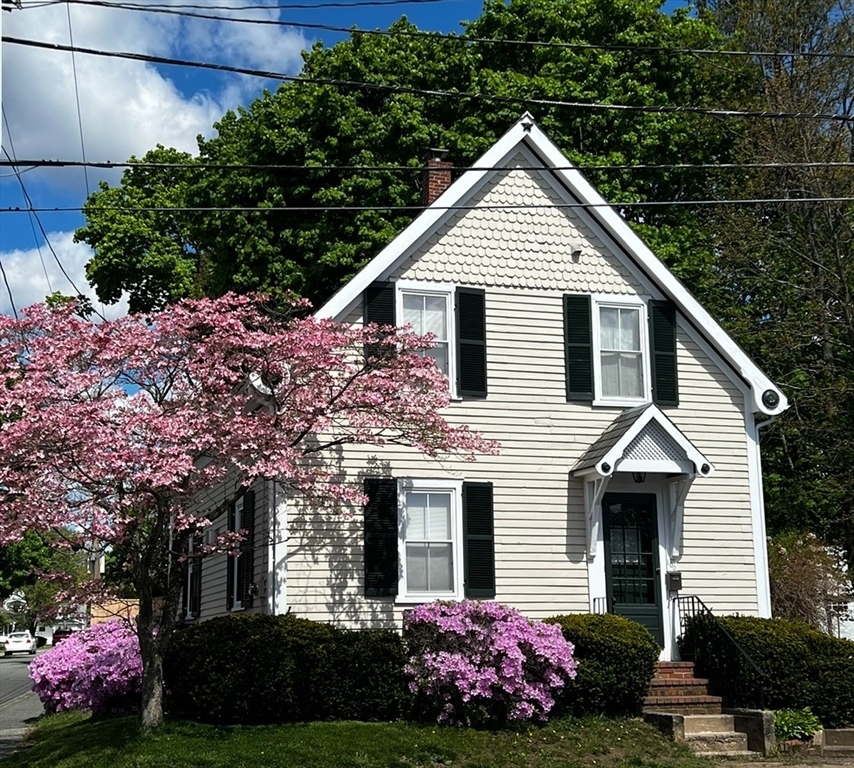 100 Willow Street Hamilton, MA 01982 - Photo 1 of 35 a front view of a house with a garden