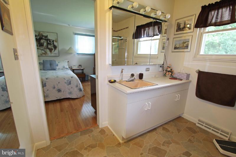 412 Whitaker Mill Road Fallston, MD 21047 - Photo 13 of 25 a utility room with a sink a window and a couch