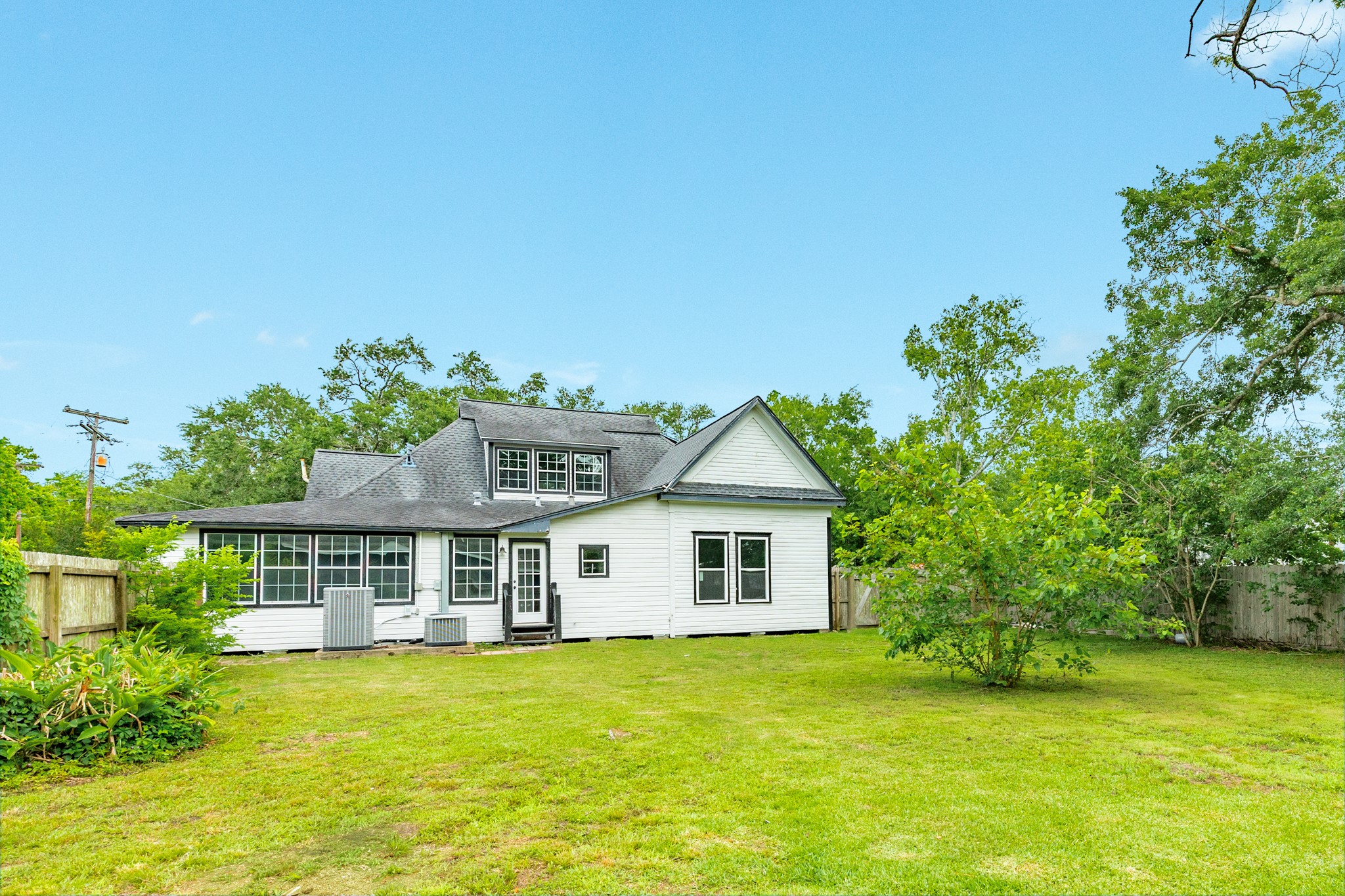 336 North Rockisland Street Angleton, TX 77515 - Photo 2 of 32 a front view of a house with a garden