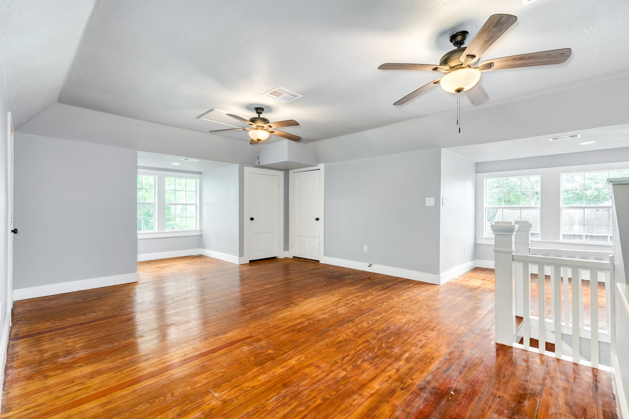 336 North Rockisland Street Angleton, TX 77515 - Photo 25 of 32 a view of an empty room with a window and wooden floor