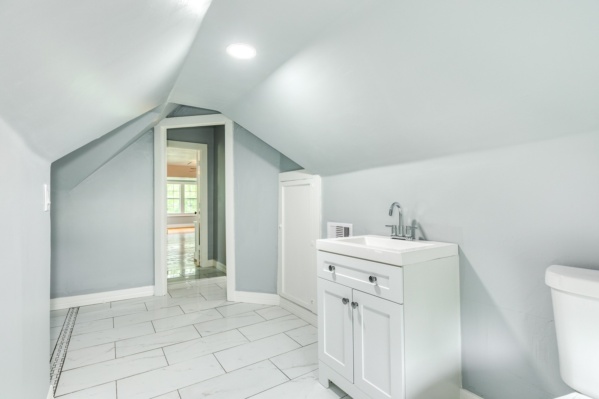336 North Rockisland Street Angleton, TX 77515 - Photo 28 of 32 a spacious bathroom with a sink a toilet and a mirror