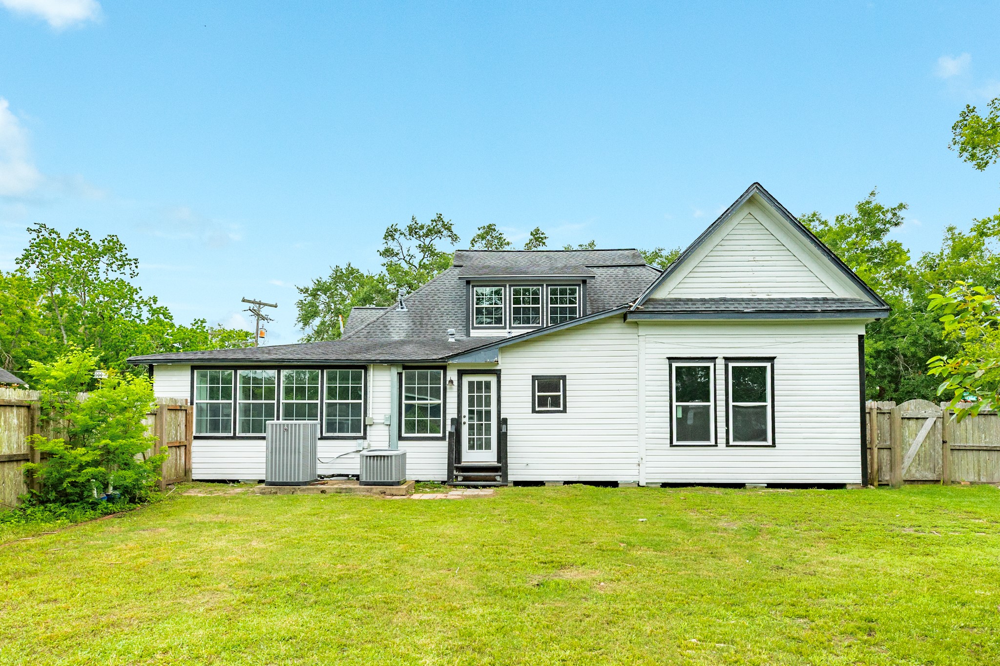336 North Rockisland Street Angleton, TX 77515 - Photo 31 of 32 a view of a house with a yard and potted plants
