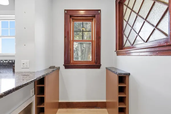 a view of a kitchen cabinets and a window