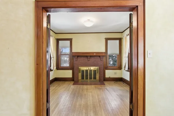a view of livingroom with furniture and a fireplace