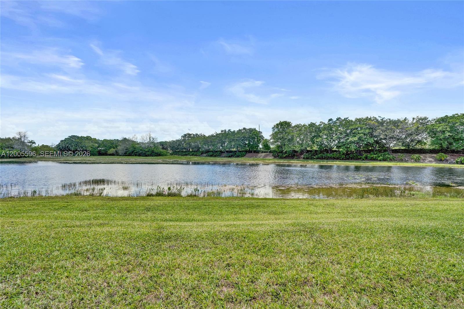 4281 Laurel Ridge Circle Weston, FL 33331 - Photo 67 of 80 a view of a lake with houses in the back