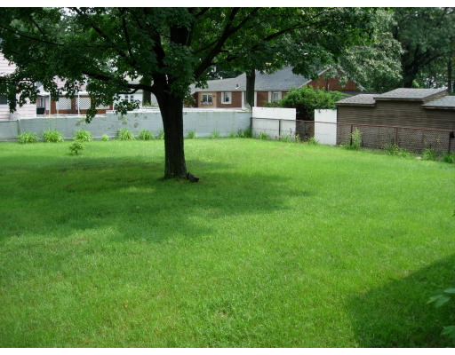 108 Harvey Street Springfield, MA 01119 - Photo 7 of 7 a view of a house with a yard