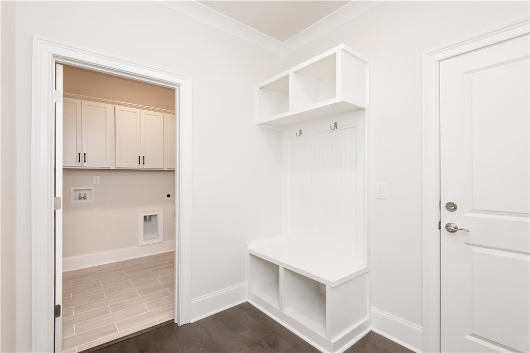 220 Holly Br Road Piedmont, SC 29673 - Photo 22 of 33 This organized mudroom with built-in storage provides a convenient transition into the home's functional laundry area.