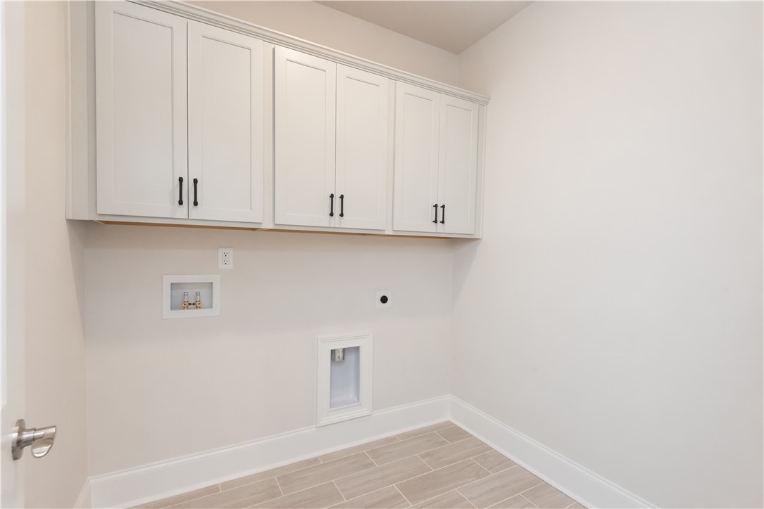 220 Holly Br Road Piedmont, SC 29673 - Photo 23 of 33 This dedicated laundry space offers practical convenience with ample storage.