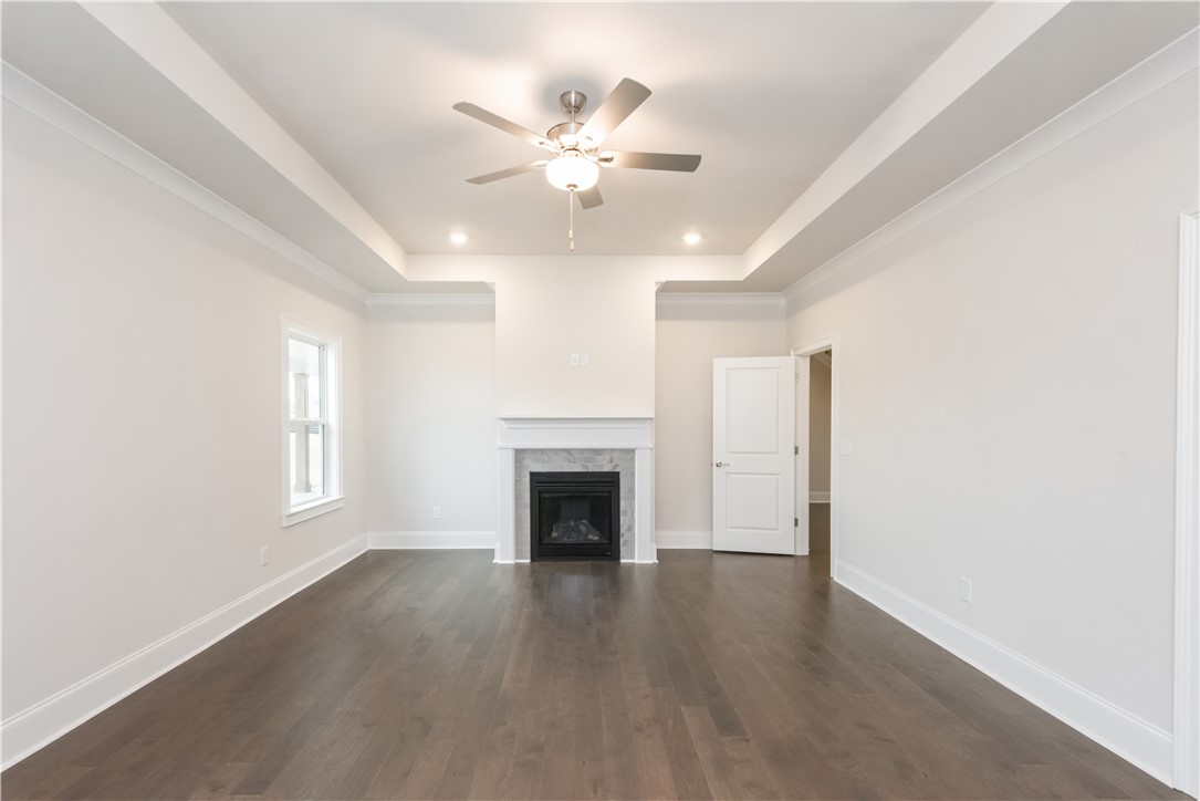220 Holly Br Road Piedmont, SC 29673 - Photo 24 of 33 This expansive room features beautiful flooring and a cozy fireplace, perfect for relaxation.