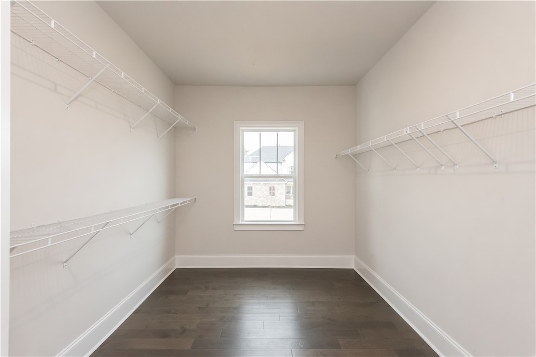 220 Holly Br Road Piedmont, SC 29673 - Photo 29 of 33 This spacious walk-in closet features ample shelving and elegant hardwood flooring.