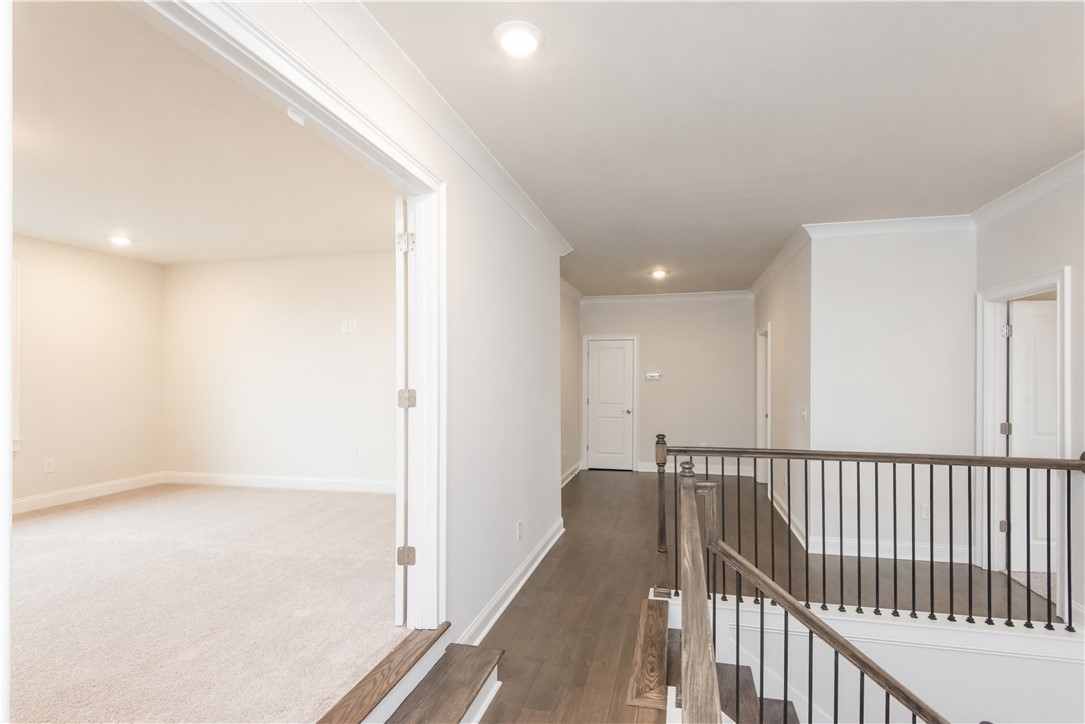 220 Holly Br Road Piedmont, SC 29673 - Photo 31 of 33 This bright hallway connects to a spacious room, showcasing a modern and inviting interior.