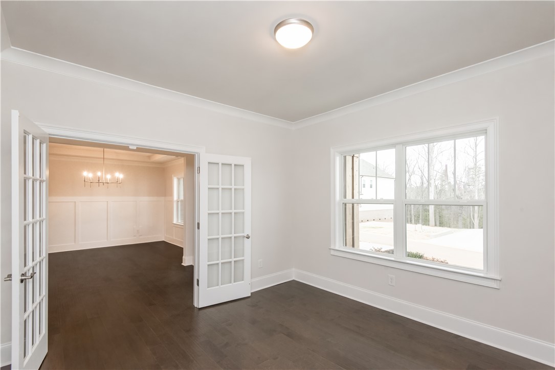 220 Holly Br Road Piedmont, SC 29673 - Photo 9 of 33 This versatile room features elegant hardwood flooring and abundant natural light.