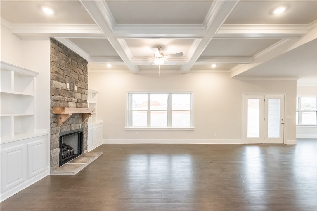 220 Holly Br Road Piedmont, SC 29673 - Photo 10 of 33 This expansive living area features a grand fireplace and elegant coffered ceilings.