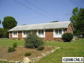 1217 Neal Street Monroe, NC 28112 - Photo 3 of 8 a front view of a house with a yard