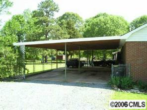 1217 Neal Street Monroe, NC 28112 - Photo 4 of 8 a backyard of a house with lots of green space