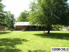 1217 Neal Street Monroe, NC 28112 - Photo 6 of 8 a view of a backyard with a garden and entertaining space