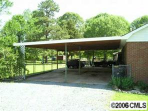 1217 Neal Street Monroe, NC 28112 - Photo 7 of 8 a backyard of a house with lots of green space