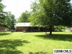 1217 Neal Street Monroe, NC 28112 - Photo 8 of 8 a view of a backyard with a garden and entertaining space