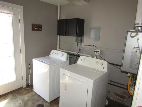 a utility room with dryer and washer