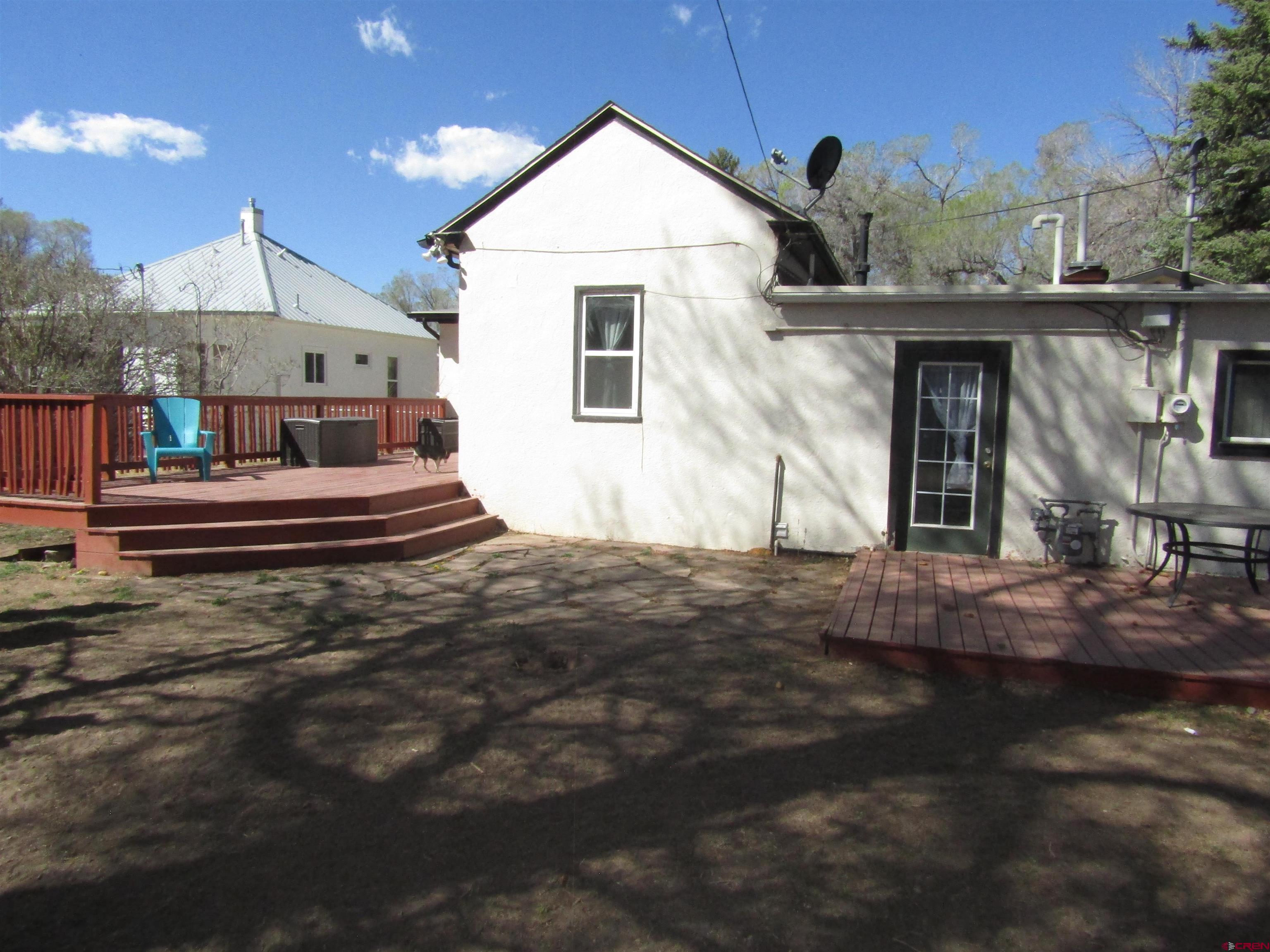18 Morris Street Monte Vista, CO 81144 - Photo 13 of 14 a front view of a house with a yard