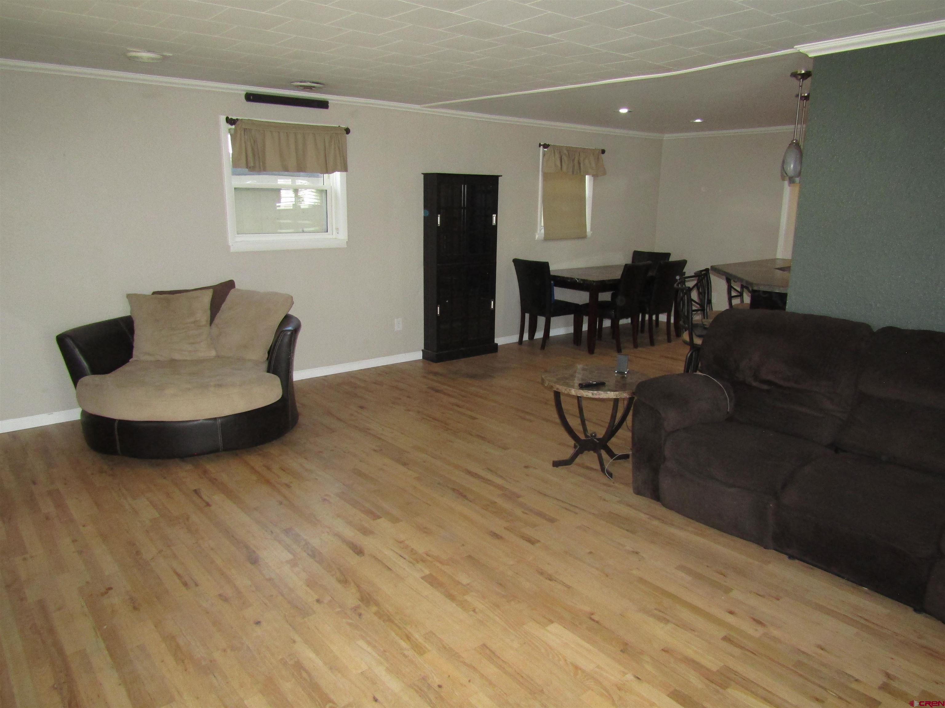 18 Morris Street Monte Vista, CO 81144 - Photo 5 of 14 a living room with furniture and kitchen view