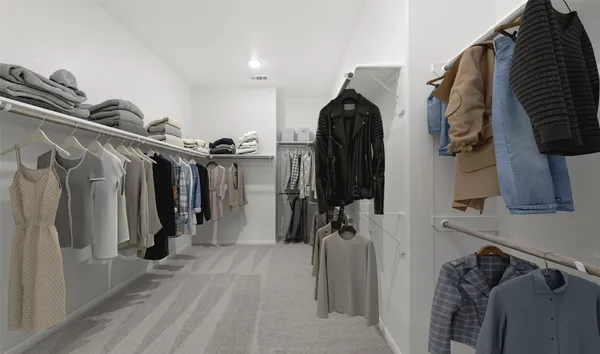 a bedroom with a bed and a lamp