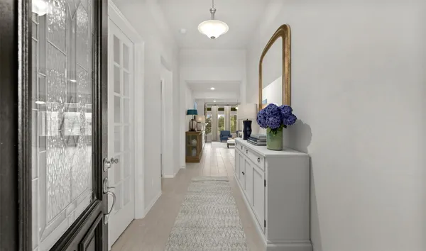 a view of a hallway with a chandelier
