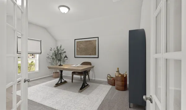 a work room with furniture a rug and a window