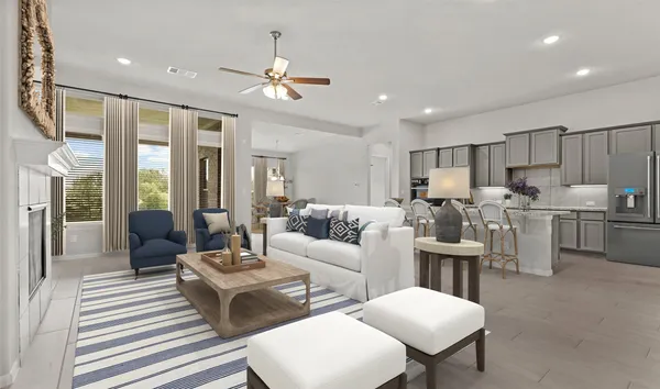 a living room with furniture kitchen view and a chandelier