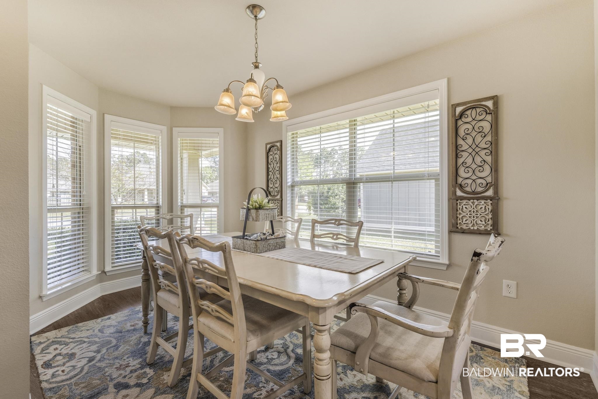 22043 Garland Loop Silverhill, AL 36576 - Photo 9 of 41 Dining space featuring a chandelier and dark wood finished floors