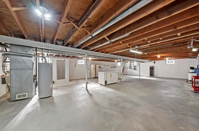 a view of empty room with wooden ceiling