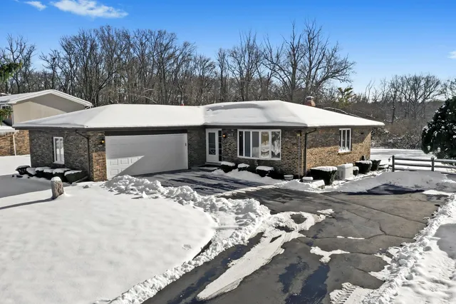 a patio with a table and chairs under an umbrella