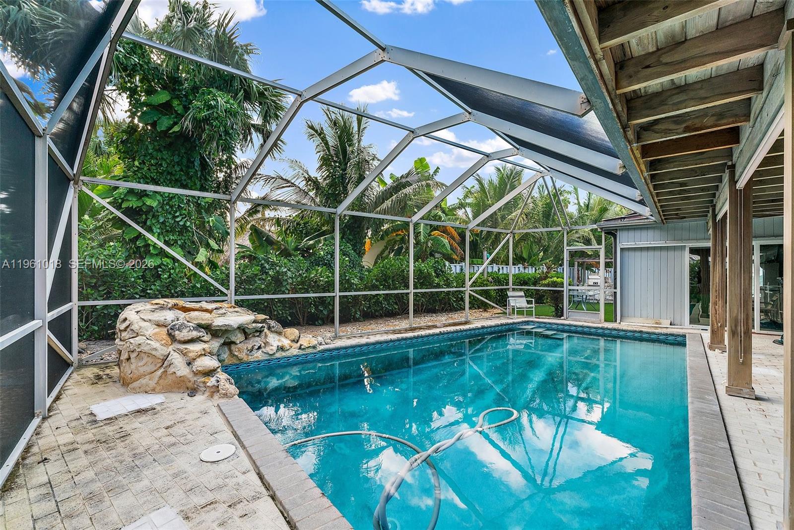 219 Colony Road Jupiter Inlet Colony, FL 33469 - Photo 10 of 33 a view of a swimming pool with a patio