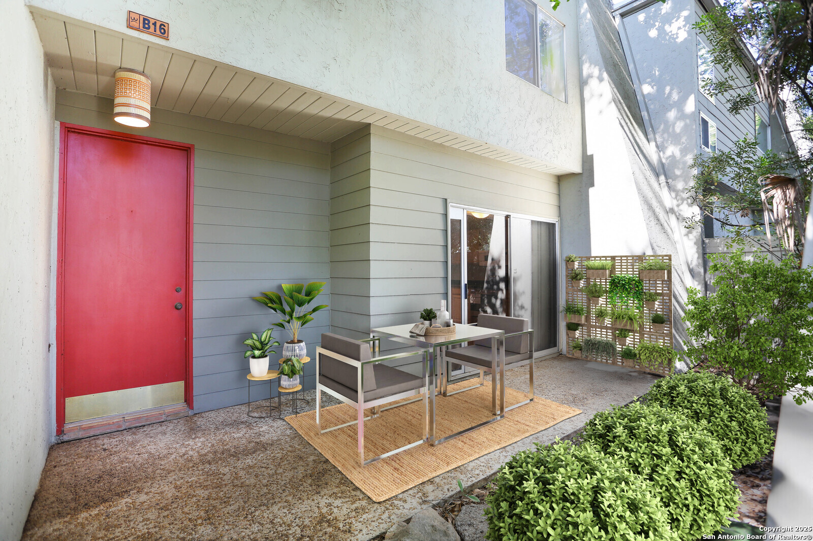 a view of a house with backyard and sitting area