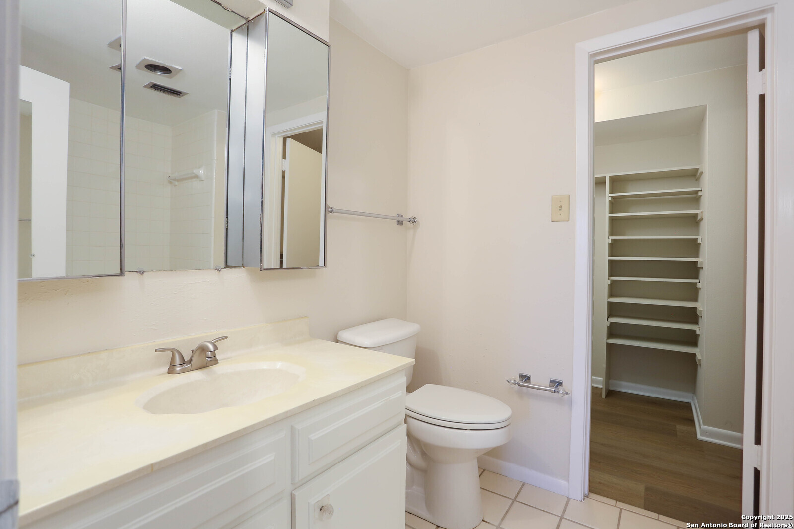 3102 Eisenhauer Road, Unit B16 San Antonio, TX 78209 - Photo 18 of 31 a bathroom with a sink a toilet and shower