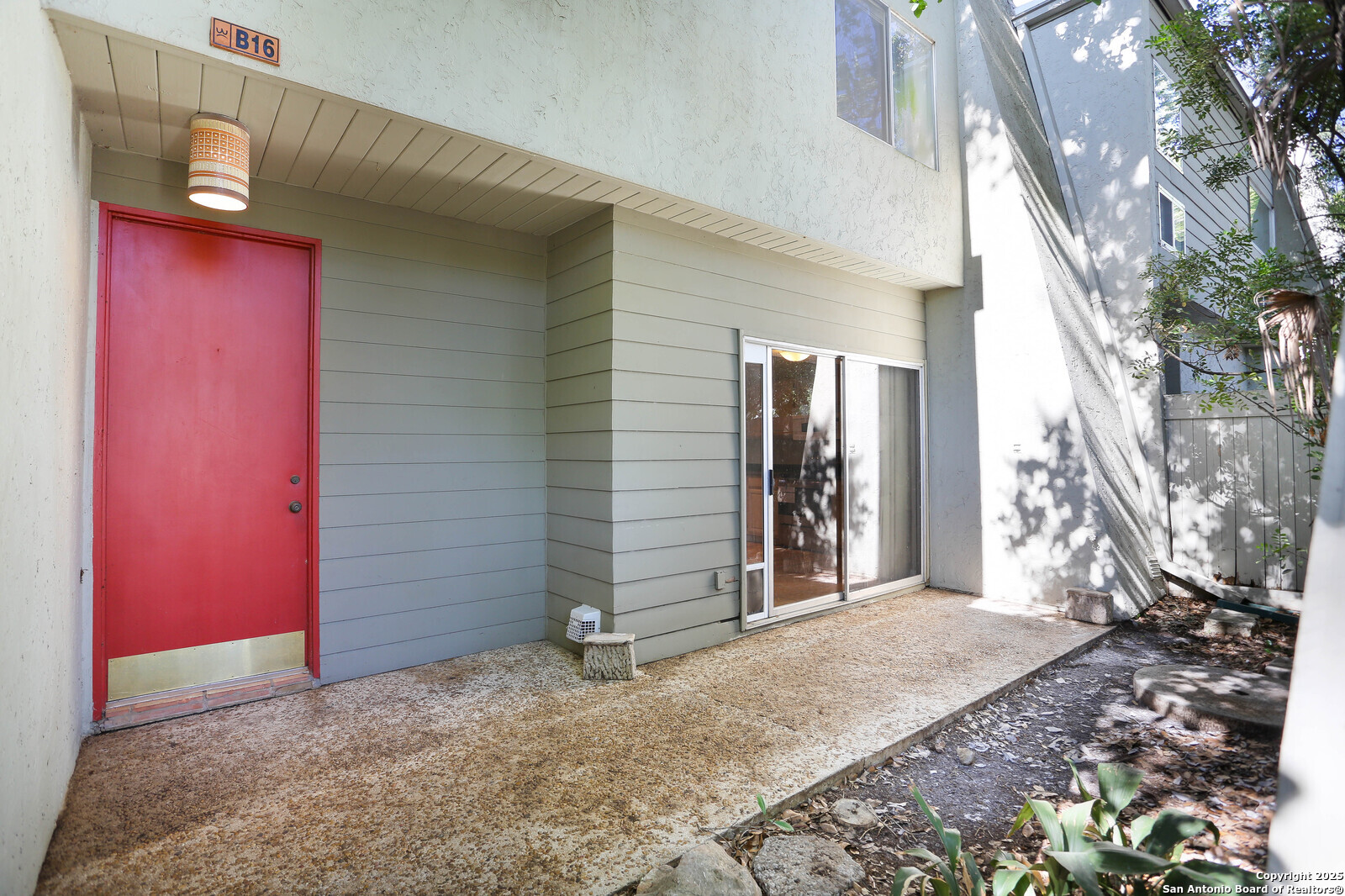3102 Eisenhauer Road, Unit B16 San Antonio, TX 78209 - Photo 2 of 31 a view of a house with a yard