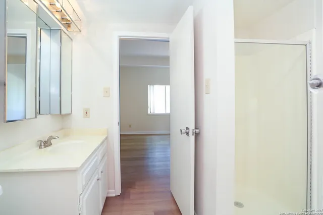 a bathroom with a sink and a mirror