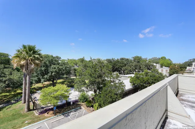 a view of a balcony with an outdoor space