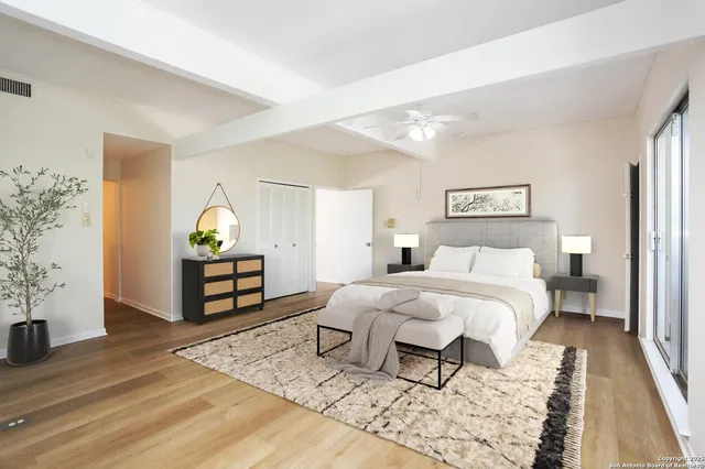 a bedroom with a bed and a table