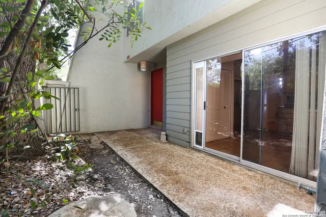 a view of backyard with green space