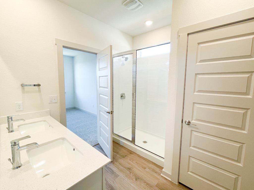 10616 Defender Trail Austin, TX 78754 - Photo 20 of 25 a bathroom with a tub and shower