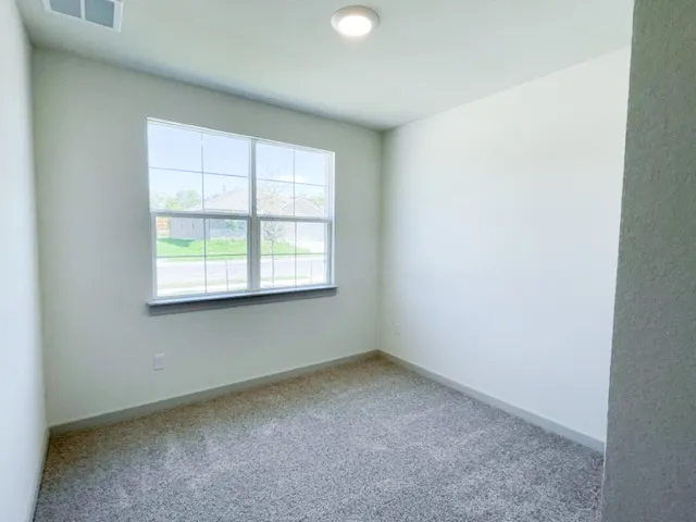 a large kitchen with a large counter top appliances and cabinets