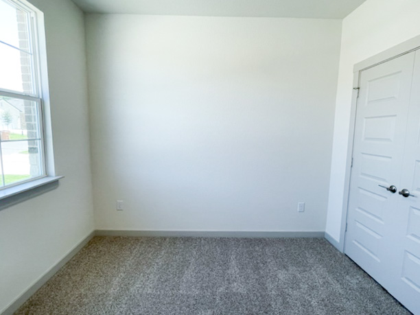 10616 Defender Trail Austin, TX 78754 - Photo 9 of 25 Carpeted empty room featuring baseboards