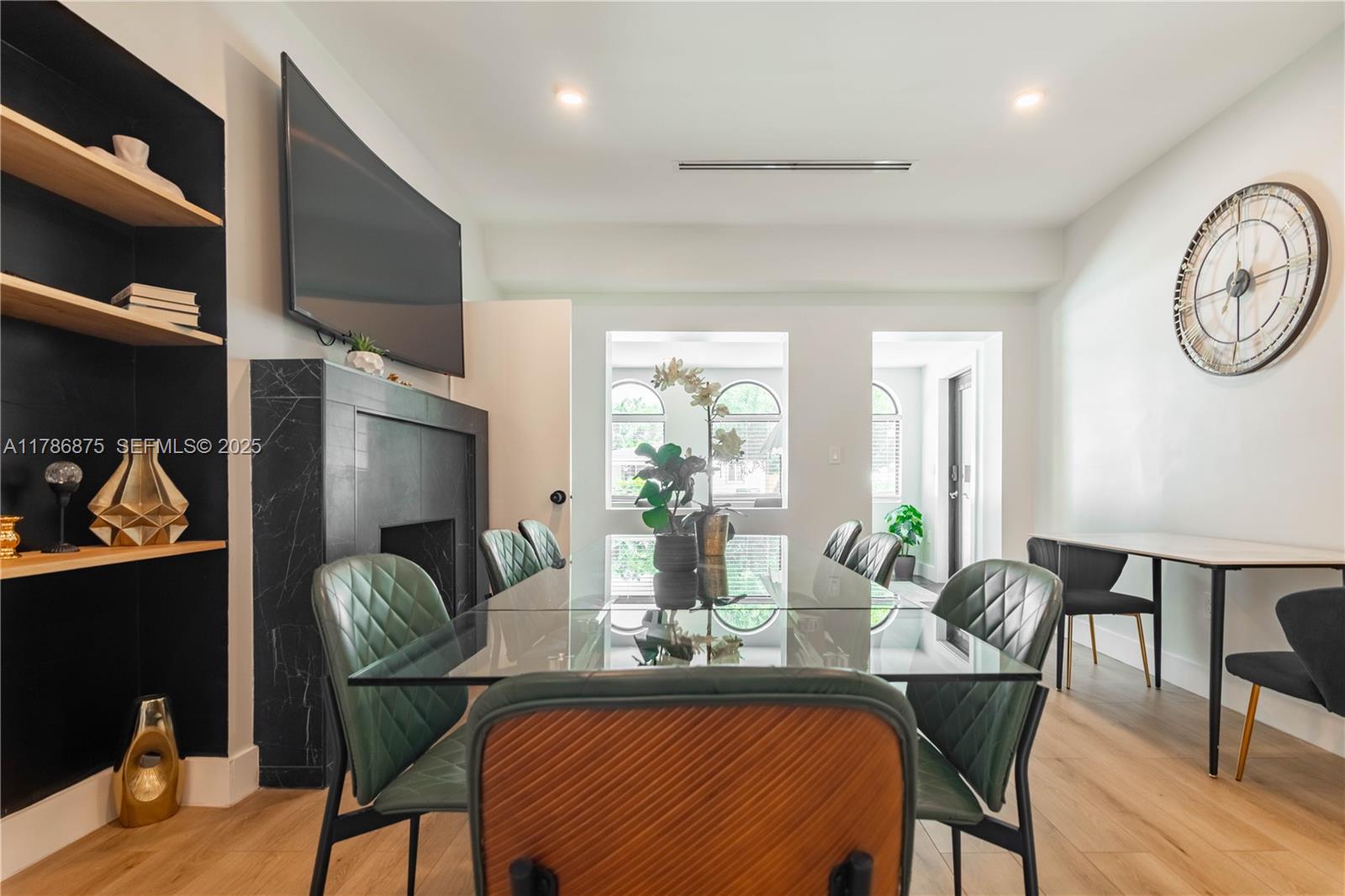 2360 Southwest 12th Street Miami, FL 33135 - Photo 13 of 78 a view of a dining room with furniture a chandelier and wooden floor