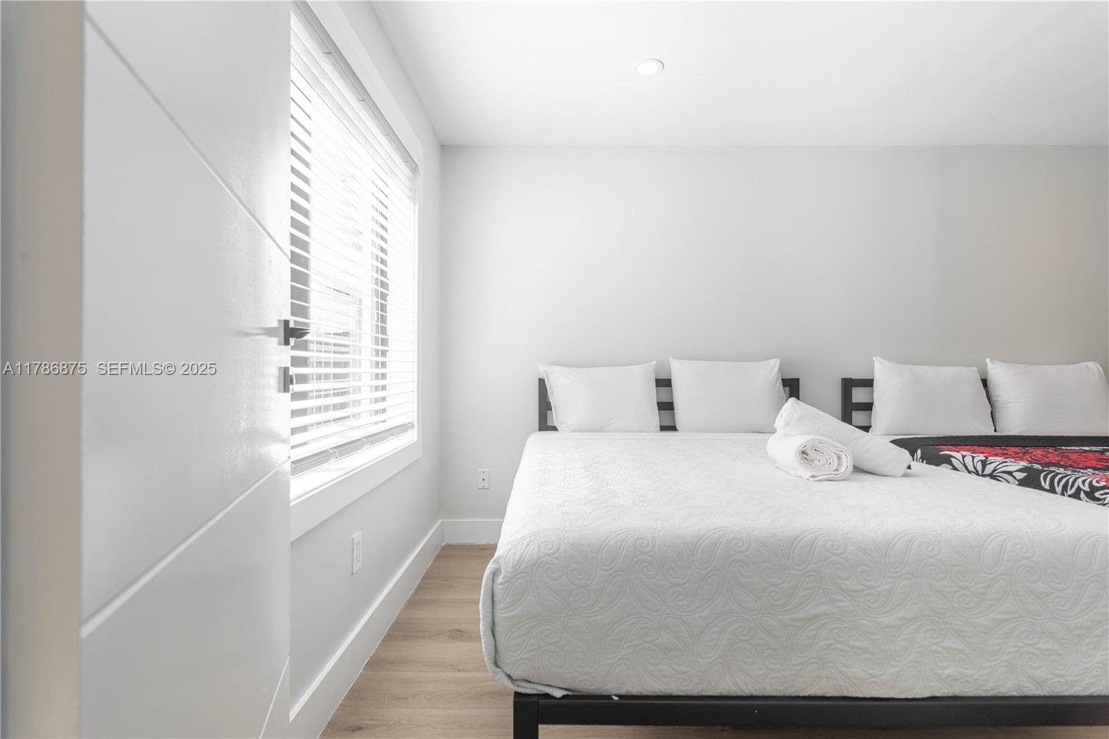 2360 Southwest 12th Street Miami, FL 33135 - Photo 25 of 78 a bedroom with a bed and a window