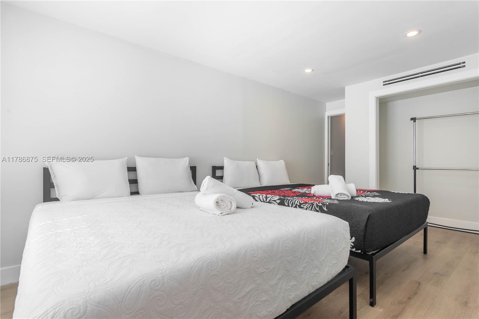 2360 Southwest 12th Street Miami, FL 33135 - Photo 26 of 78 a bedroom with a bed and a lamp