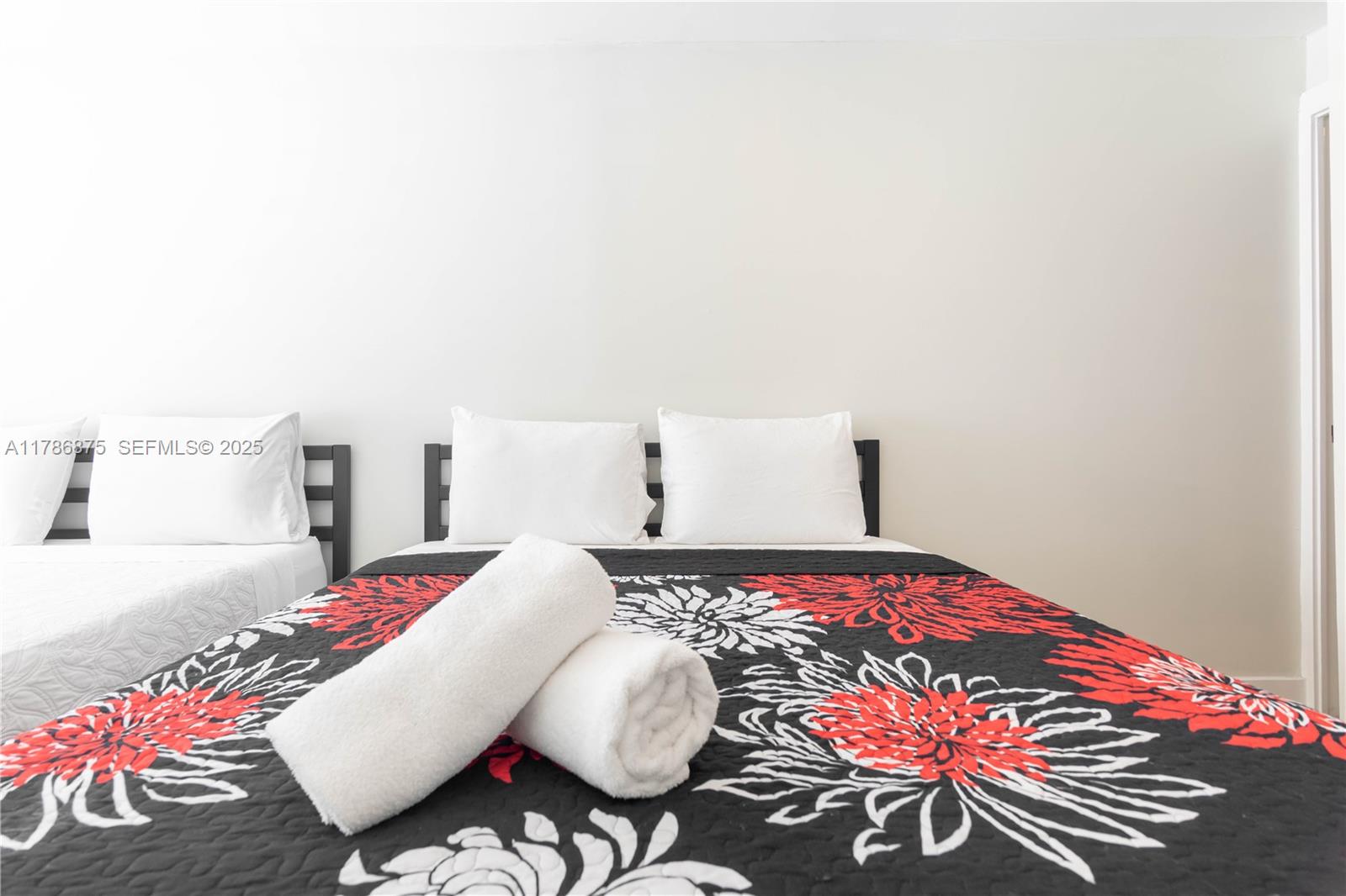 2360 Southwest 12th Street Miami, FL 33135 - Photo 29 of 78 a bedroom with a bed and a table