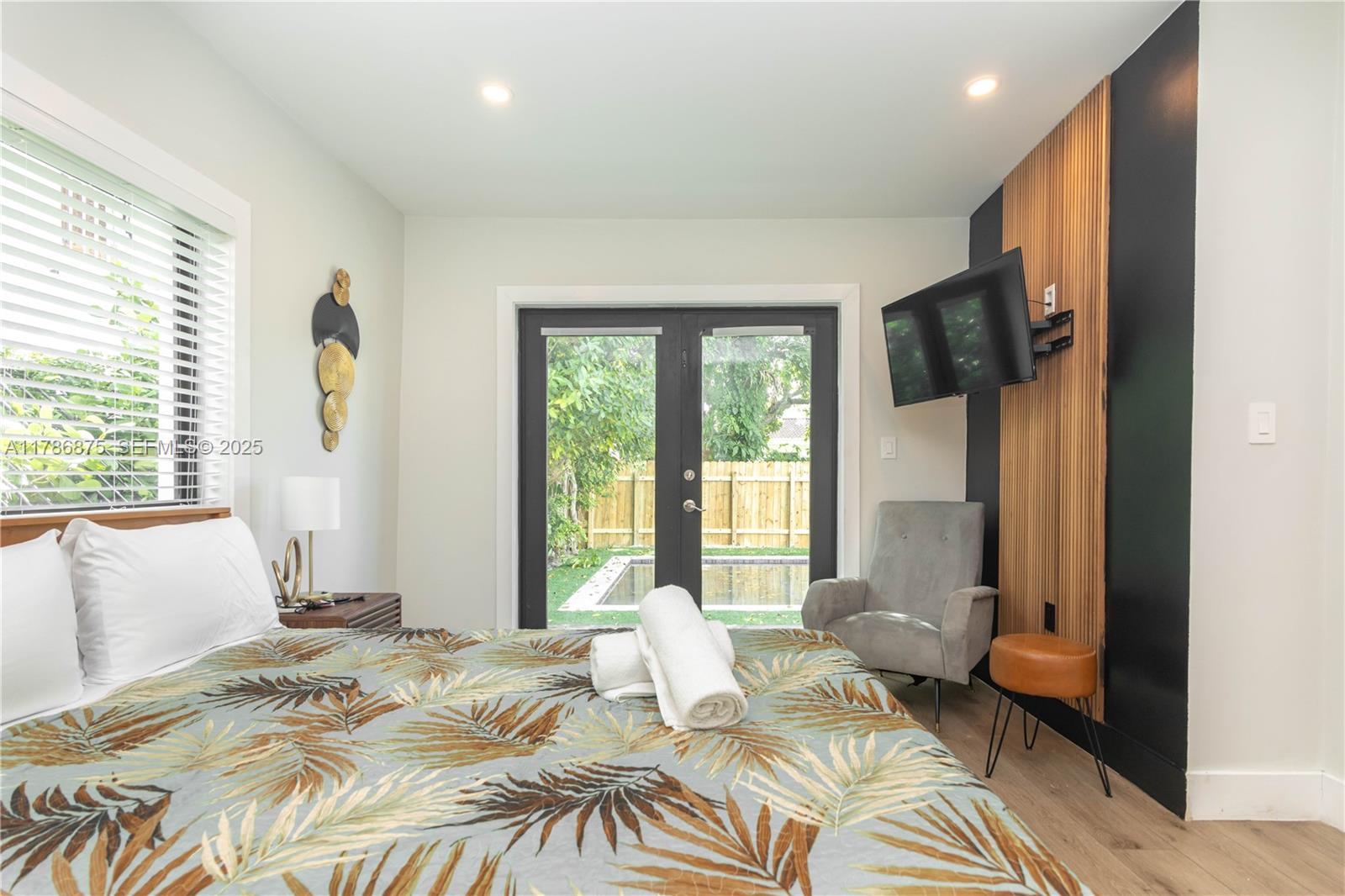 2360 Southwest 12th Street Miami, FL 33135 - Photo 35 of 78 a bedroom with a bed and a window