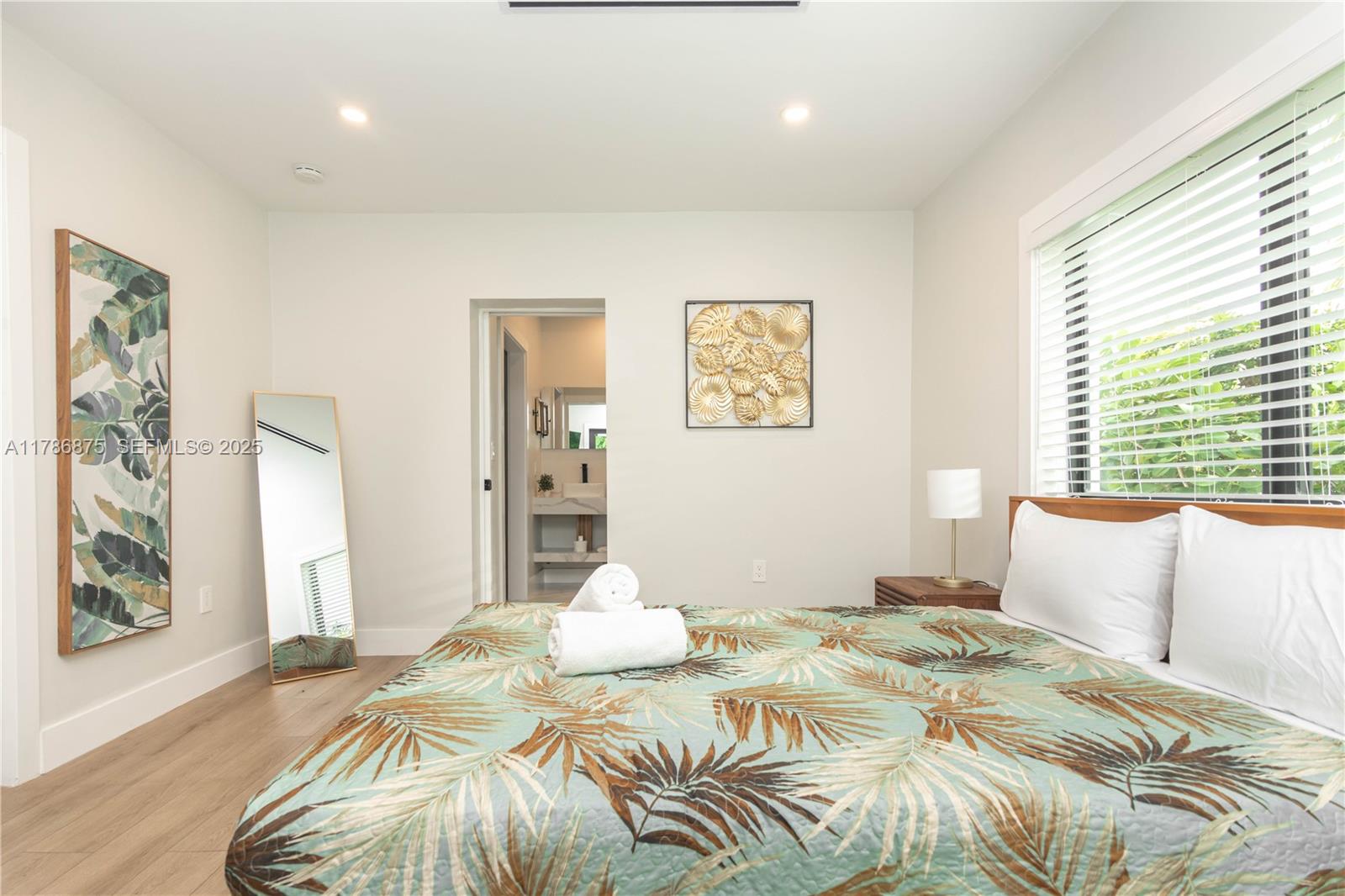 2360 Southwest 12th Street Miami, FL 33135 - Photo 37 of 78 a bedroom with a bed and a painting on the wall