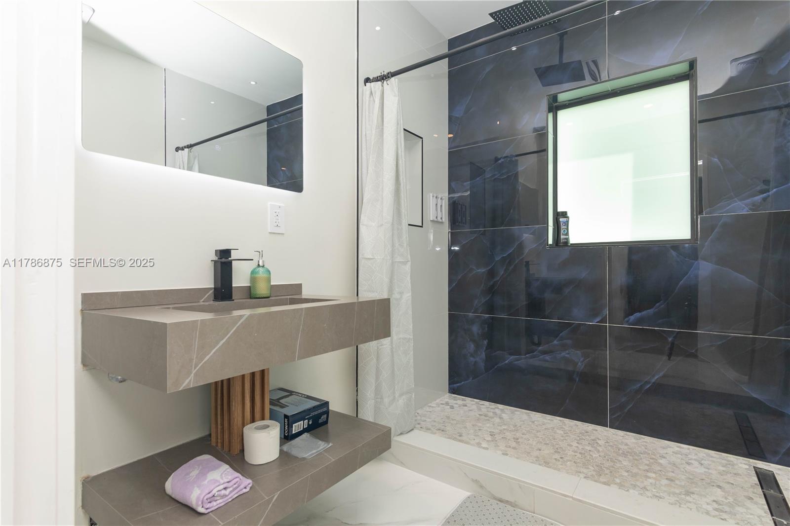 2360 Southwest 12th Street Miami, FL 33135 - Photo 46 of 78 a bathroom with a sink and a mirror